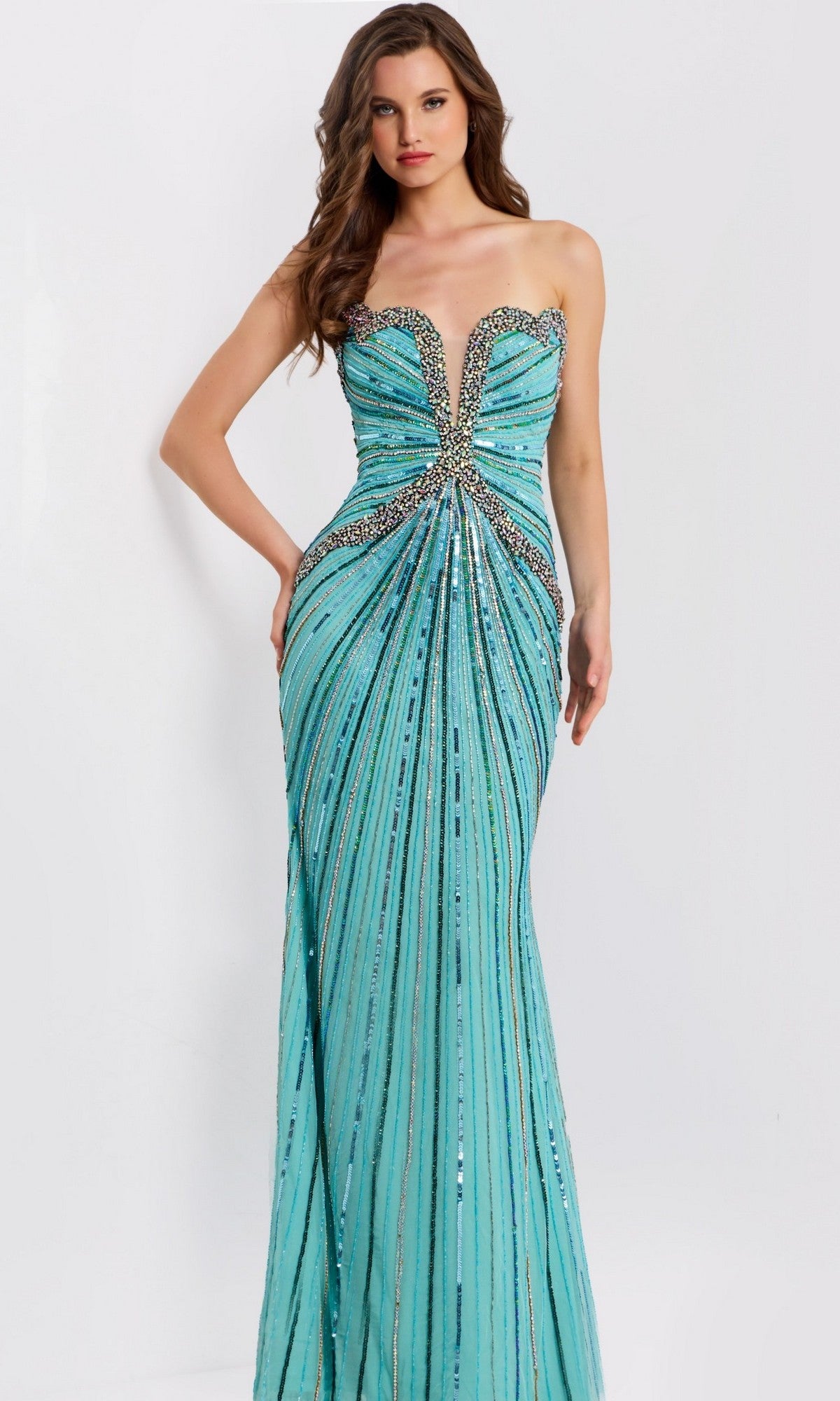 A woman wears a strapless blue Jovani 49224 long prom dress with sequin and bead embellishments, standing against a plain white background.